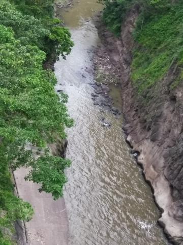 Looking at the Overflow River of the Cashi Damn, Cashi, Costa Rica