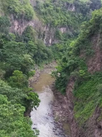 Looking at the Overflow River of the Cashi Damn, Cashi, Costa Rica